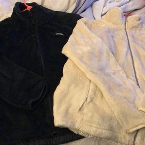 Two women’s North Face Full ZIP fleece.